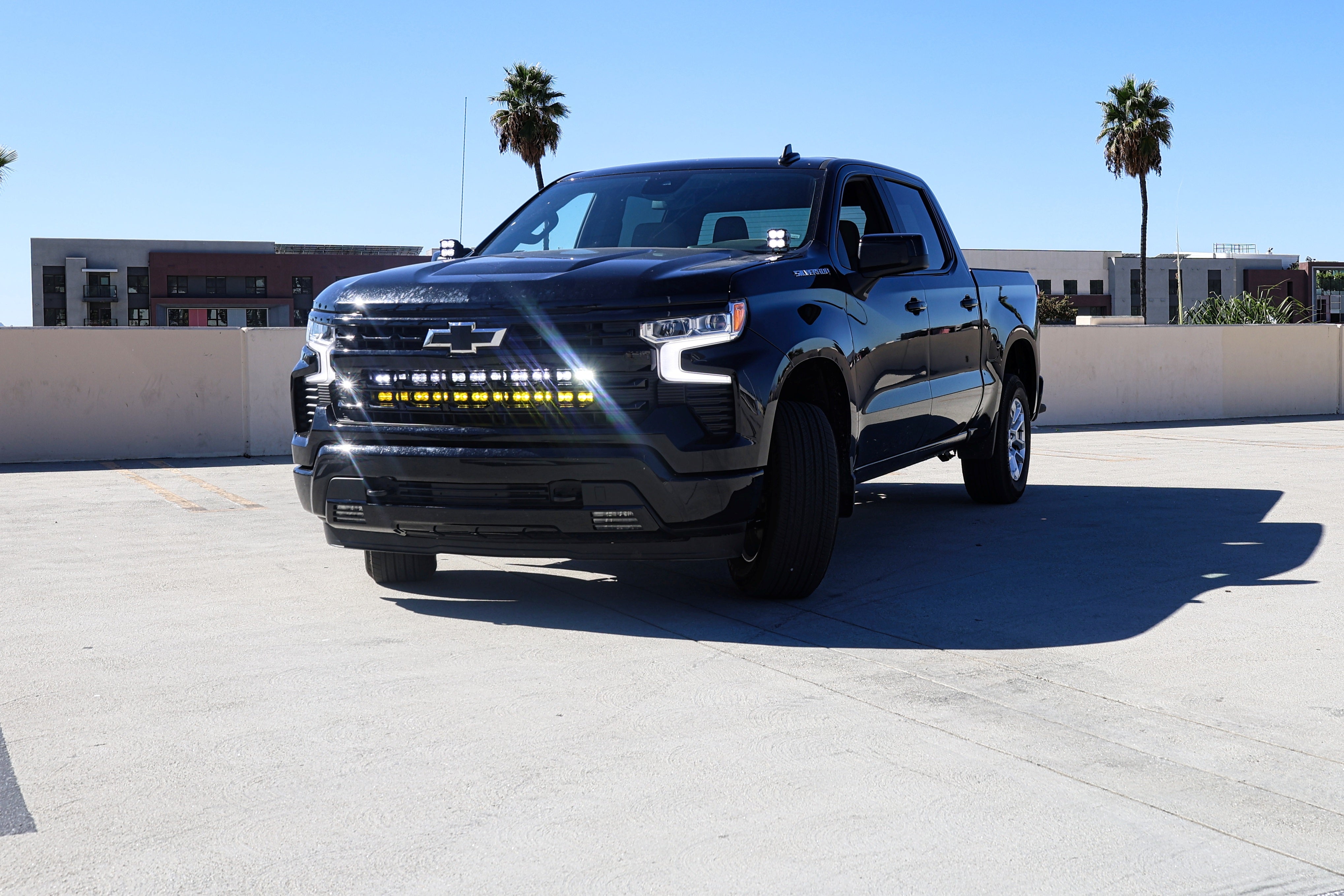 Silverado 1500 ditch lights PRO dual color LED on 2022 Chevrolet Silverado 1500 front view in daylight parking lot