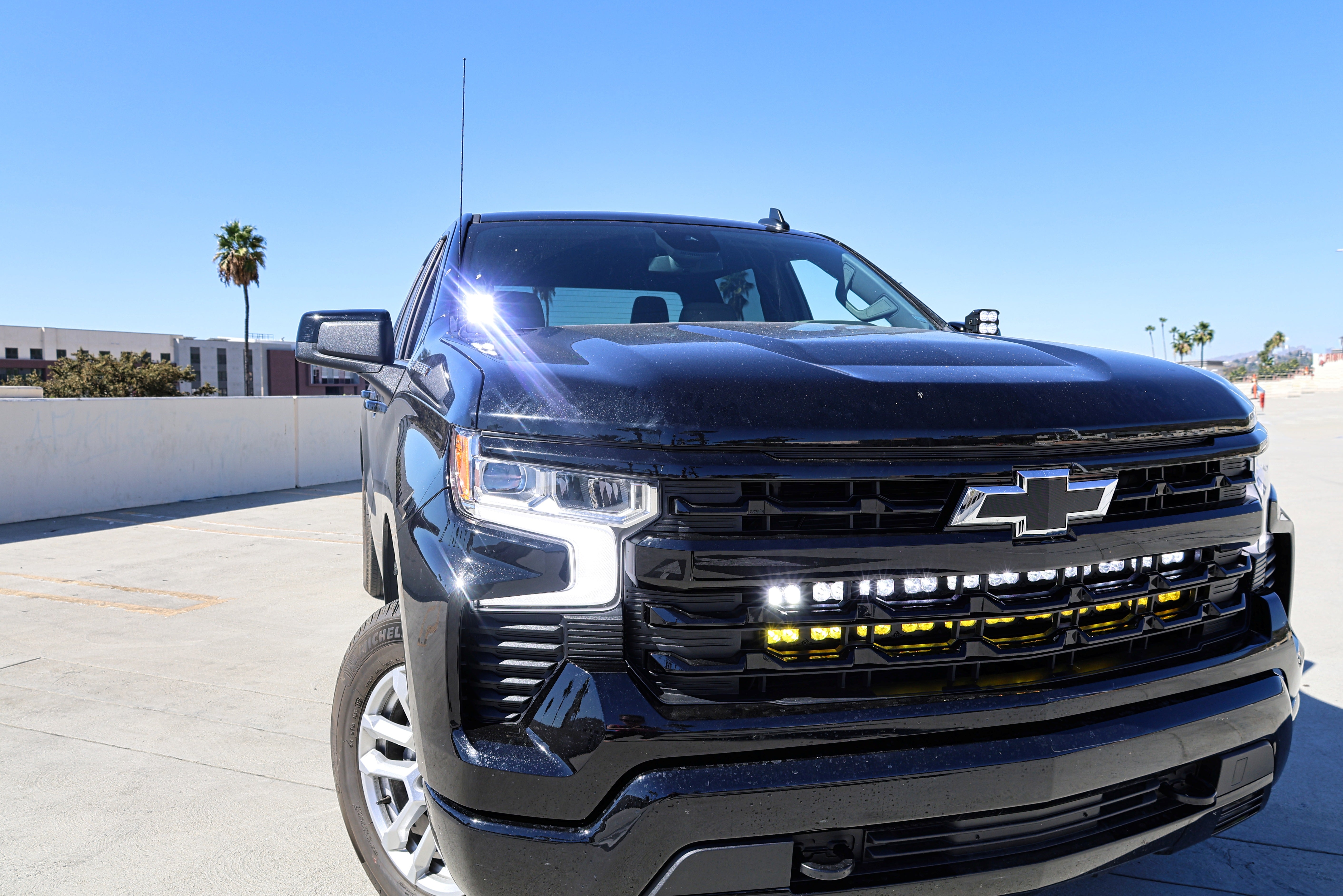 Silverado 1500 ditch lights PRO dual color LED installed on 2022+ Chevrolet Silverado 1500 front bumper and grille