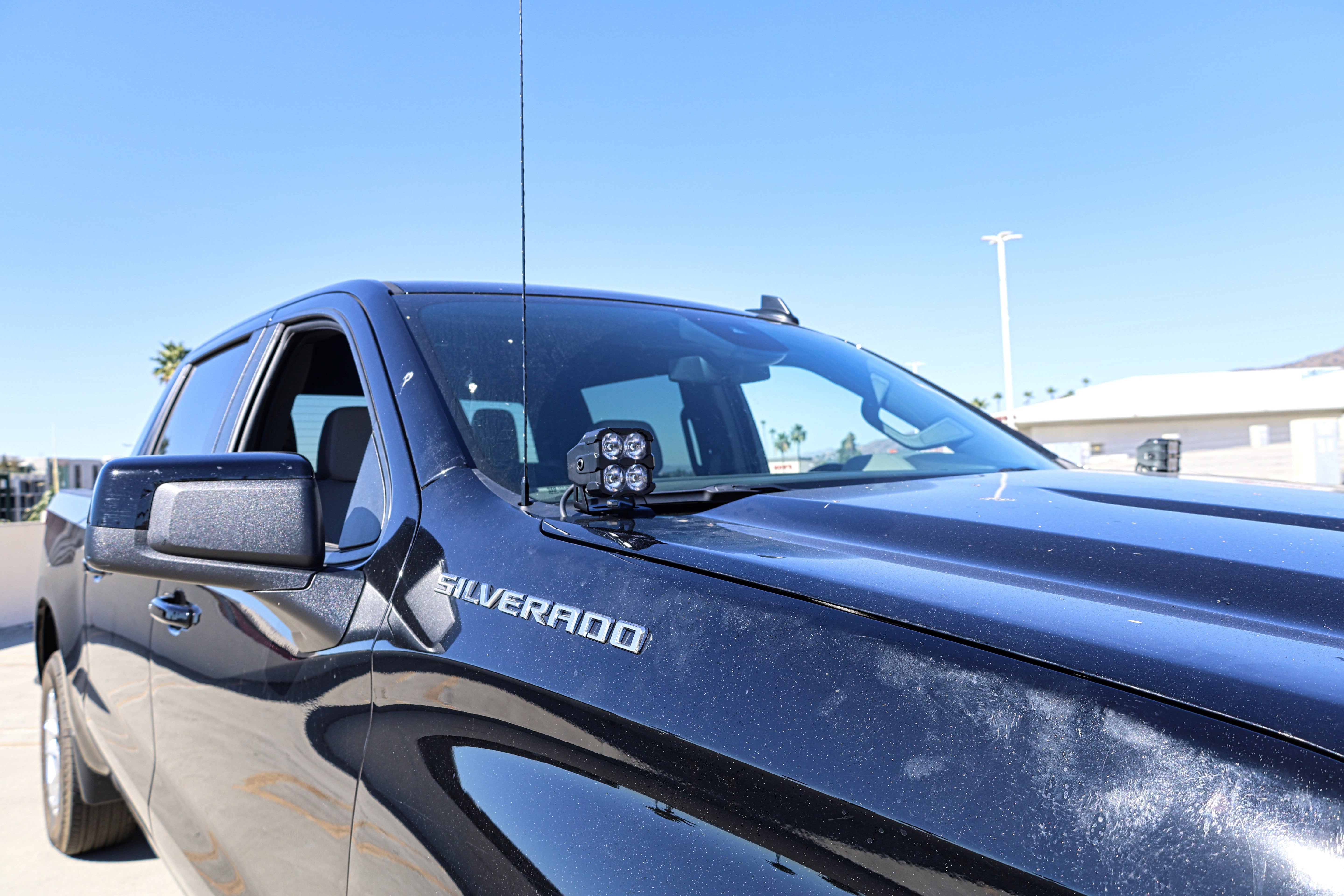 Silverado 1500 ditch lights PRO dual color LED ditch light pods mounted on 2022+ Chevy Silverado 1500 truck hood