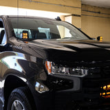 Silverado 1500 ditch lights PRO dual color LED ditch lights installed on 2022+ Chevrolet Silverado 1500 in parking garage