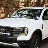 White Ford Ranger with hood-mounted LED Ditch Lights PRO installed, low-profile pods