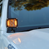2025+ Nissan Frontier LED ditch lights on a white truck, front view