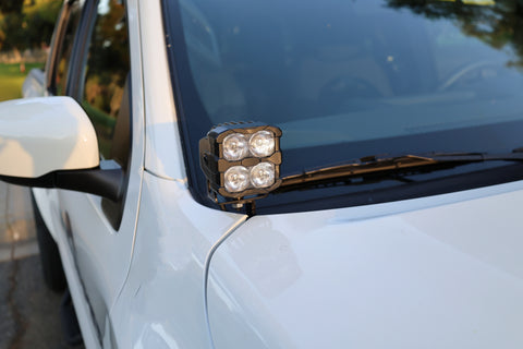 2025+ Nissan Frontier Ditch Lights PRO mounted on white truck with LED lights for enhanced visibility.