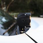 Close-up of a 2025 Nissan Frontier ditch light mounted on a vehicle's hood.