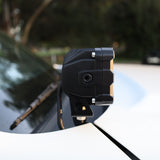 Close-up of a 2025 Nissan Frontier ditch light mounted on a vehicle's hood.