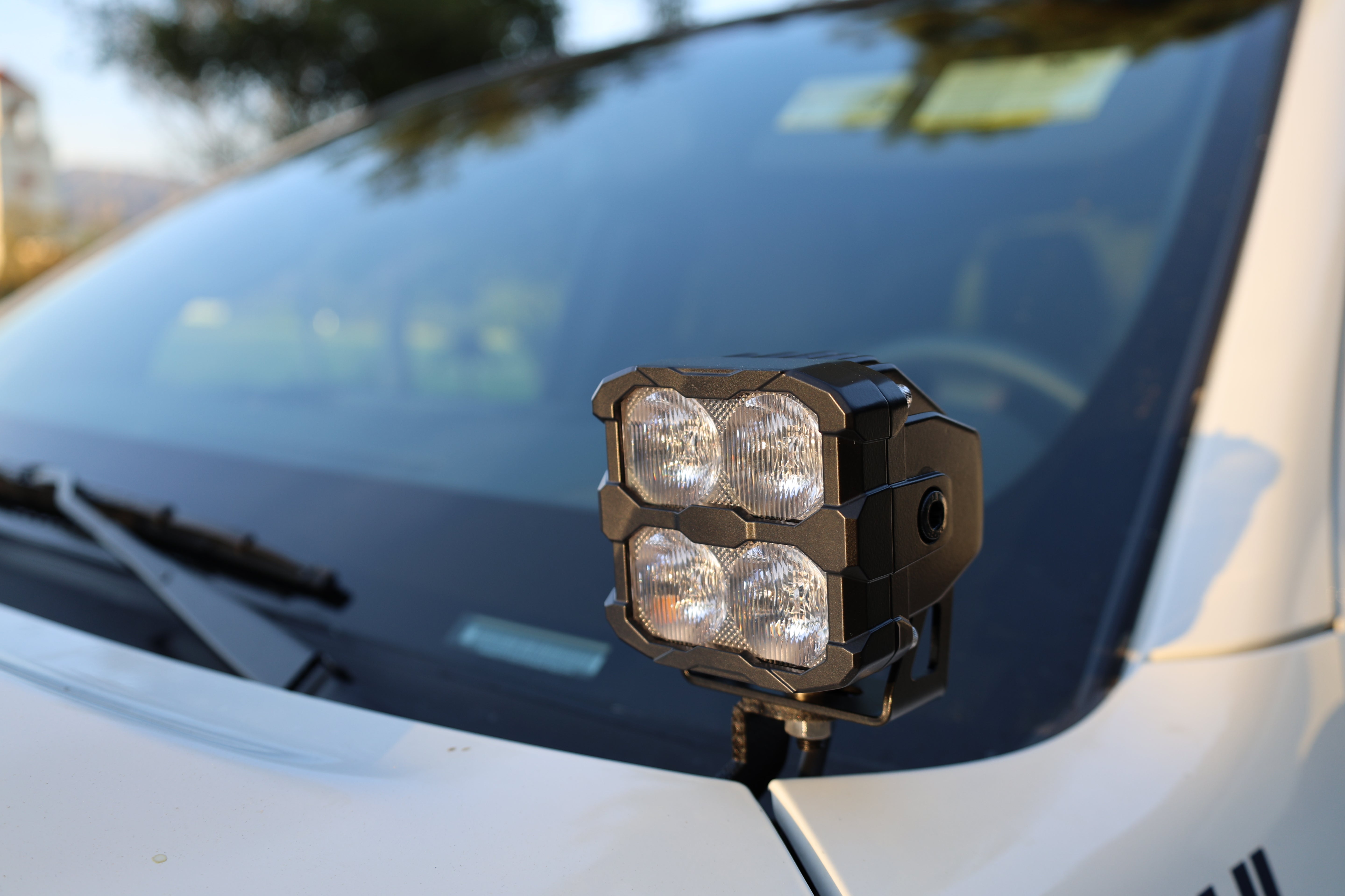 2025+ Nissan Frontier Ditch Lights PRO with dual color white LED and amber DRL, installed on a vehicle.