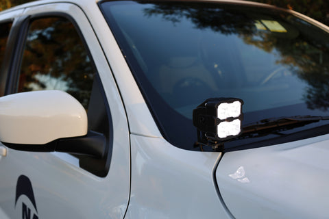 2025+ Nissan Frontier Ditch Lights PRO mounted on vehicle, showcasing bright white LEDs and amber DRL for enhanced visibility.