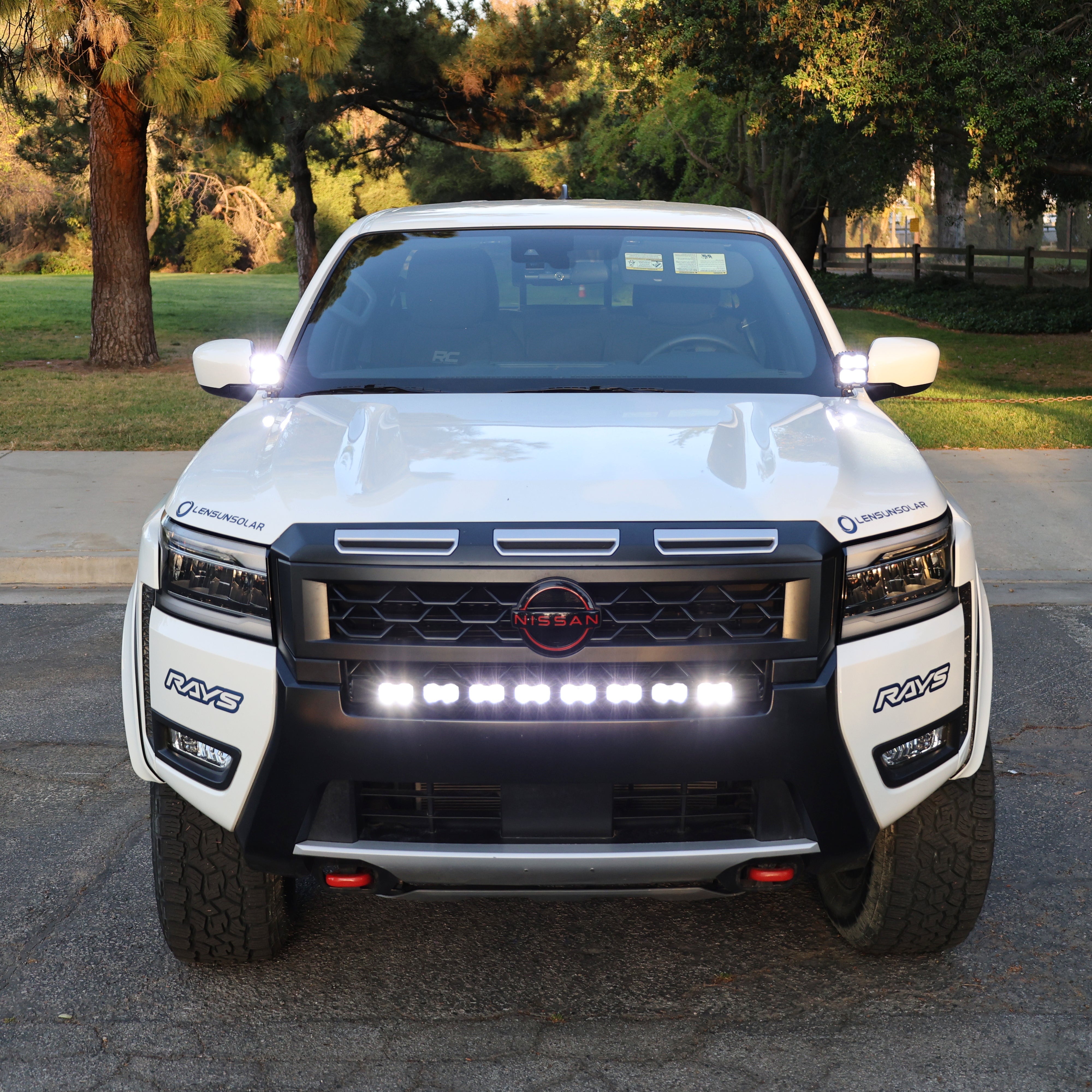 2025 Nissan Frontier with PRO ditch lights and LED lighting for enhanced visibility at night.