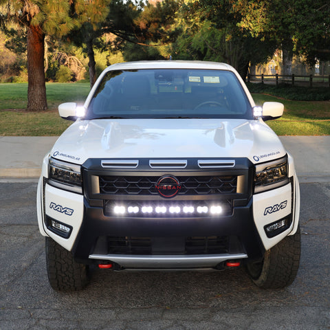 2025 Nissan Frontier with PRO ditch lights and LED lighting for enhanced visibility at night.