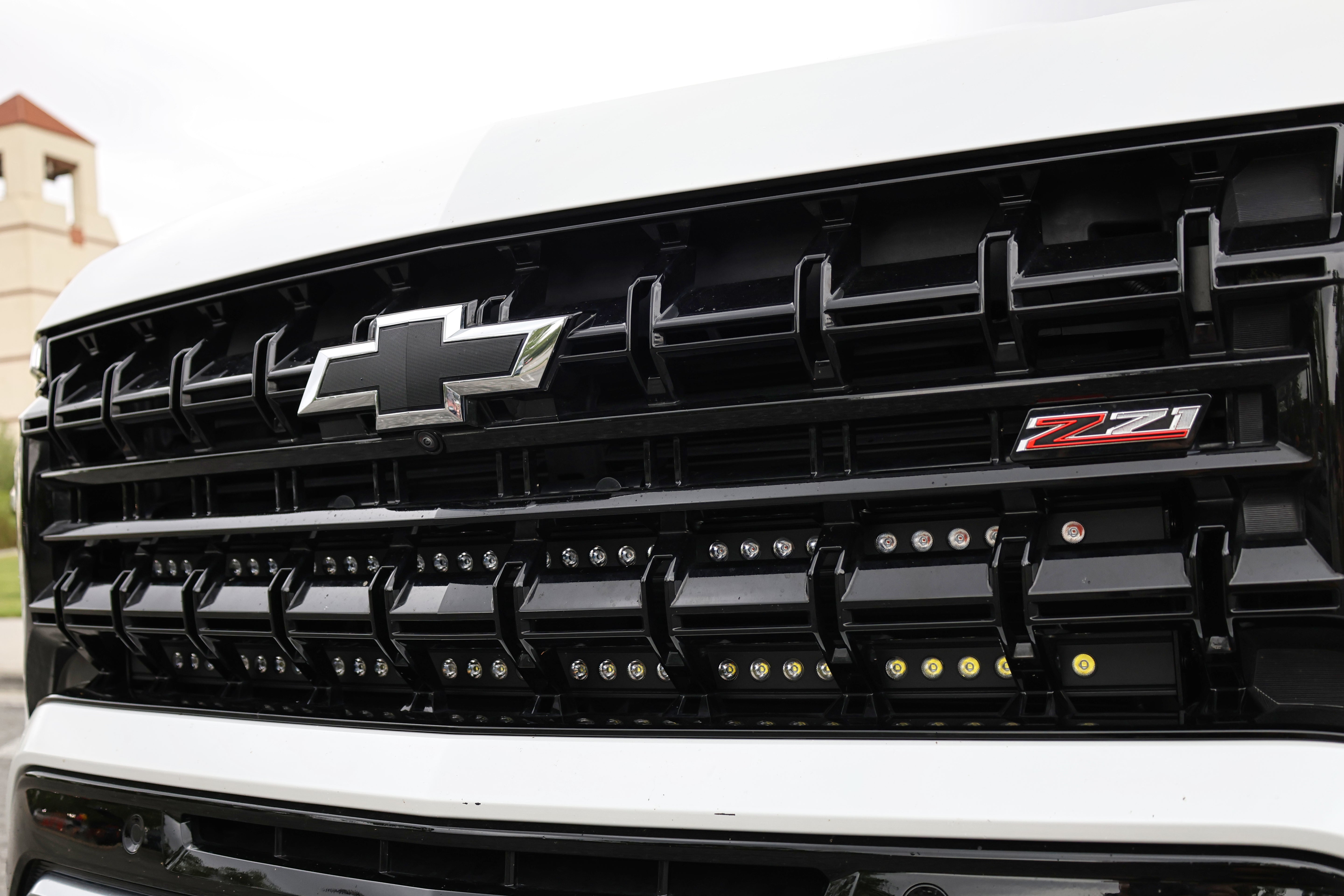 2025 Chevrolet Suburban front grille with Z71 badge and installed Suburban Light Bars
