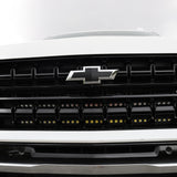 Front view of a Chevrolet Suburban with dual light bars installed, showcasing the grille and lighting functionality for Suburban Light Bars.