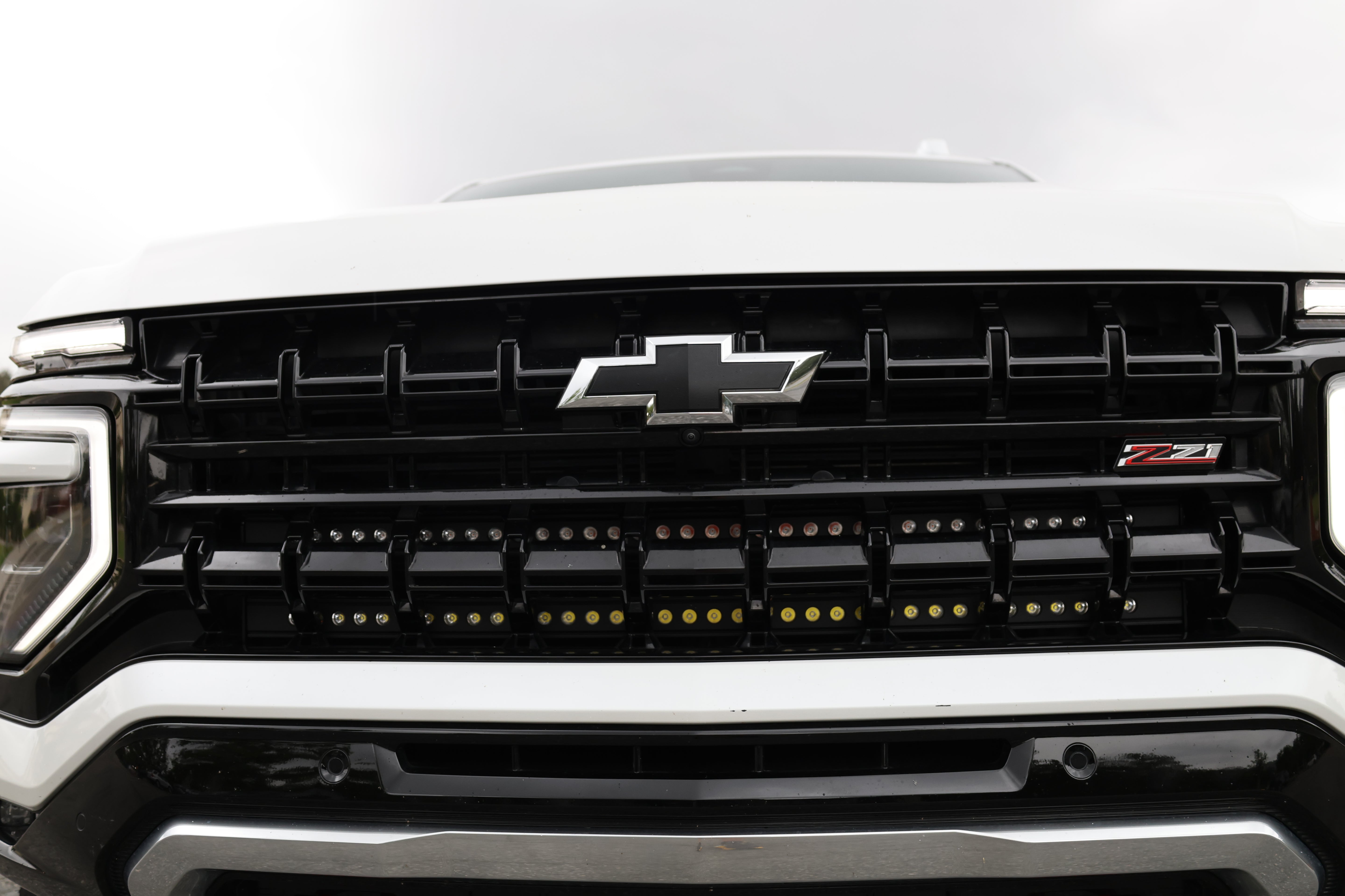 Front view of a Chevrolet Suburban with dual light bars installed, showcasing the grille and lighting functionality for Suburban Light Bars.