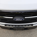 2024+ Ford F150 LightBar installed on the front grille of a Ford truck, showcasing its sleek design and bright illumination.
