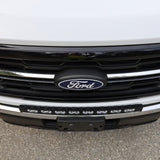 2024+ Ford F150 LightBar installed on the front grille of a Ford truck, showcasing its sleek design and bright illumination.