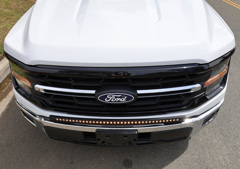 2024+ Ford F150 LightBar mounted on the front grille of a 2024 Ford F150, showcasing its sleek design and powerful lighting.