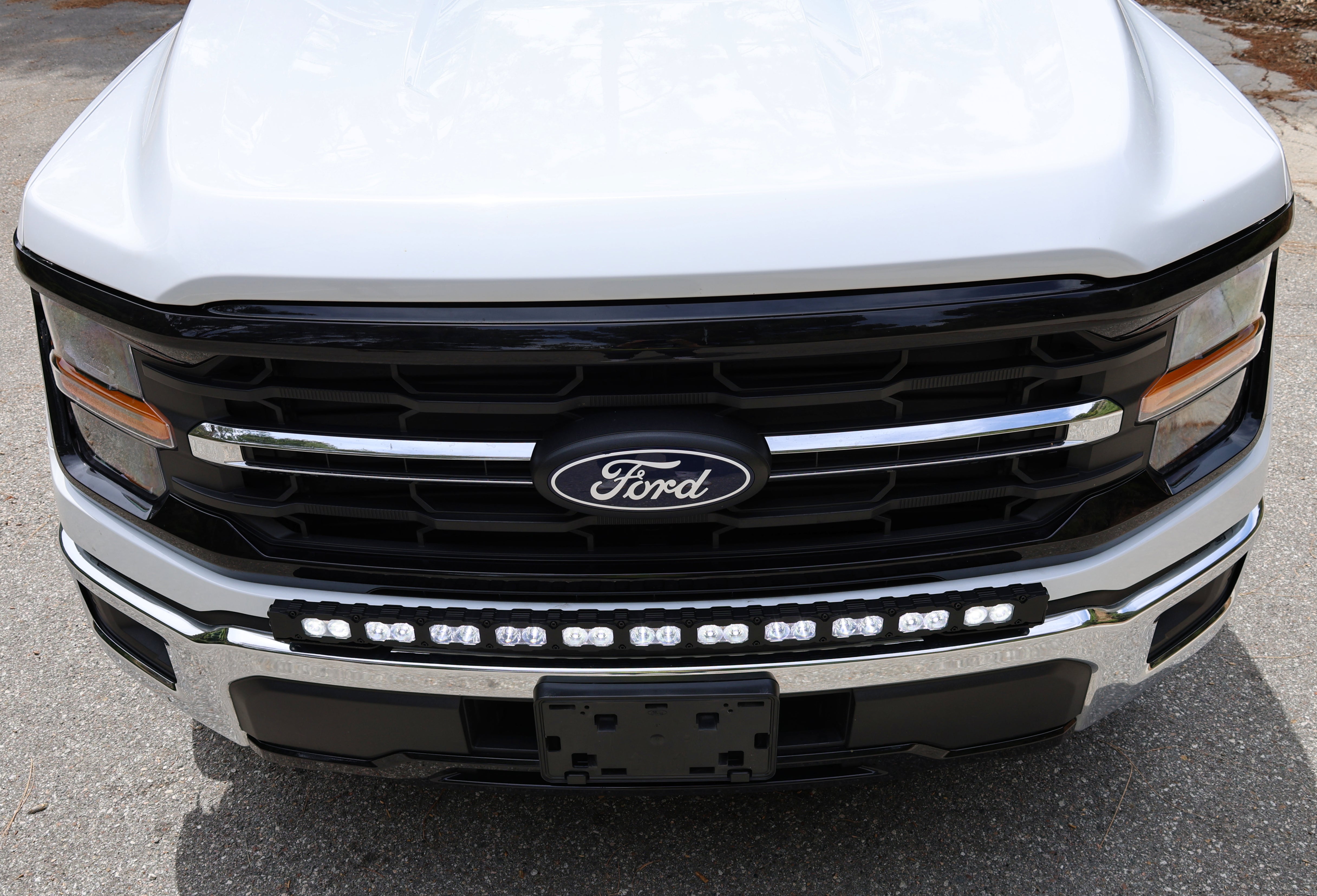 2024+ Ford F150 LightBar installed on the front grille of a Ford truck, showcasing design for off-road use.