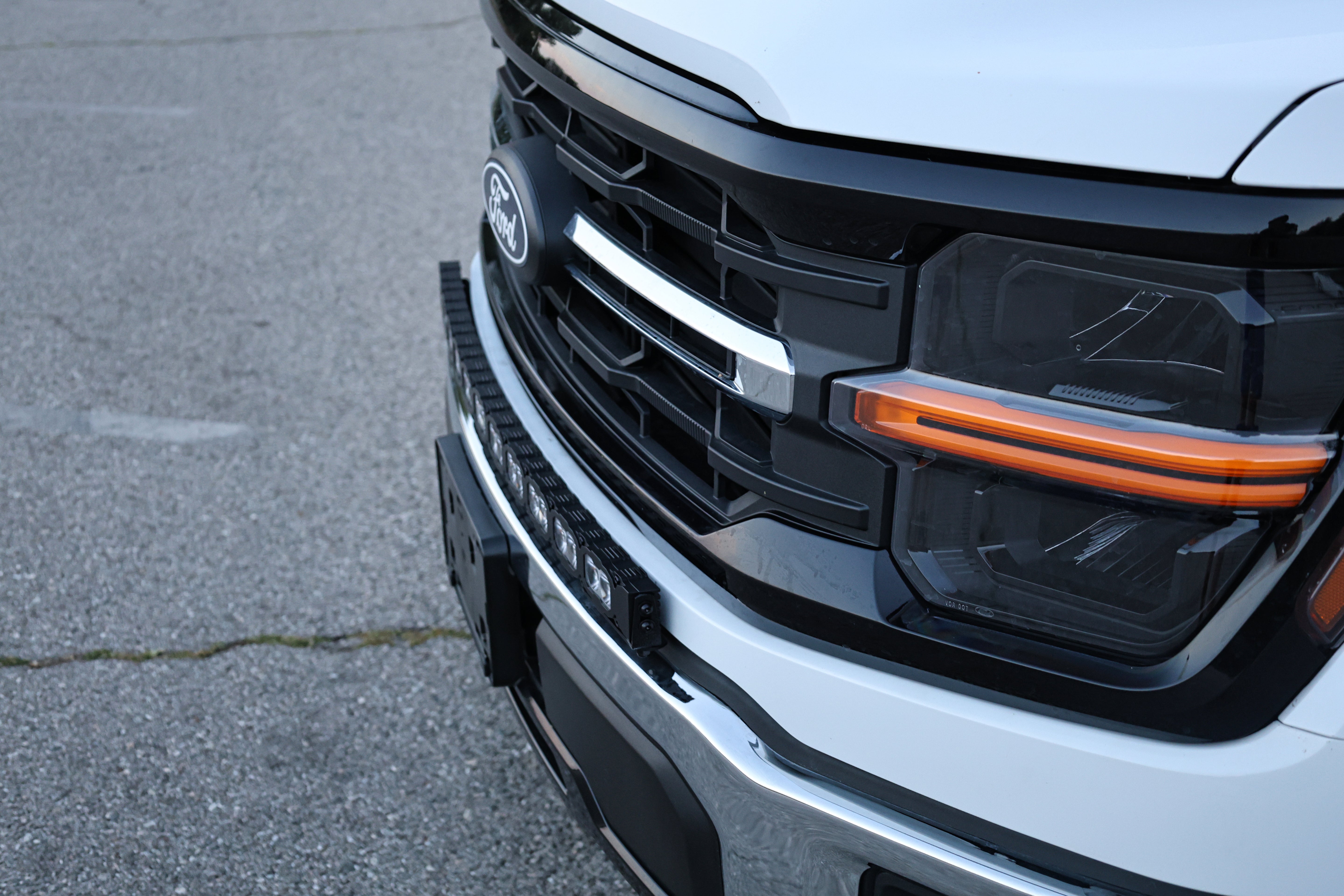 2024+ Ford F150 LightBar installed on a white Ford F150 with non-modular bumper, showcasing sleek design.