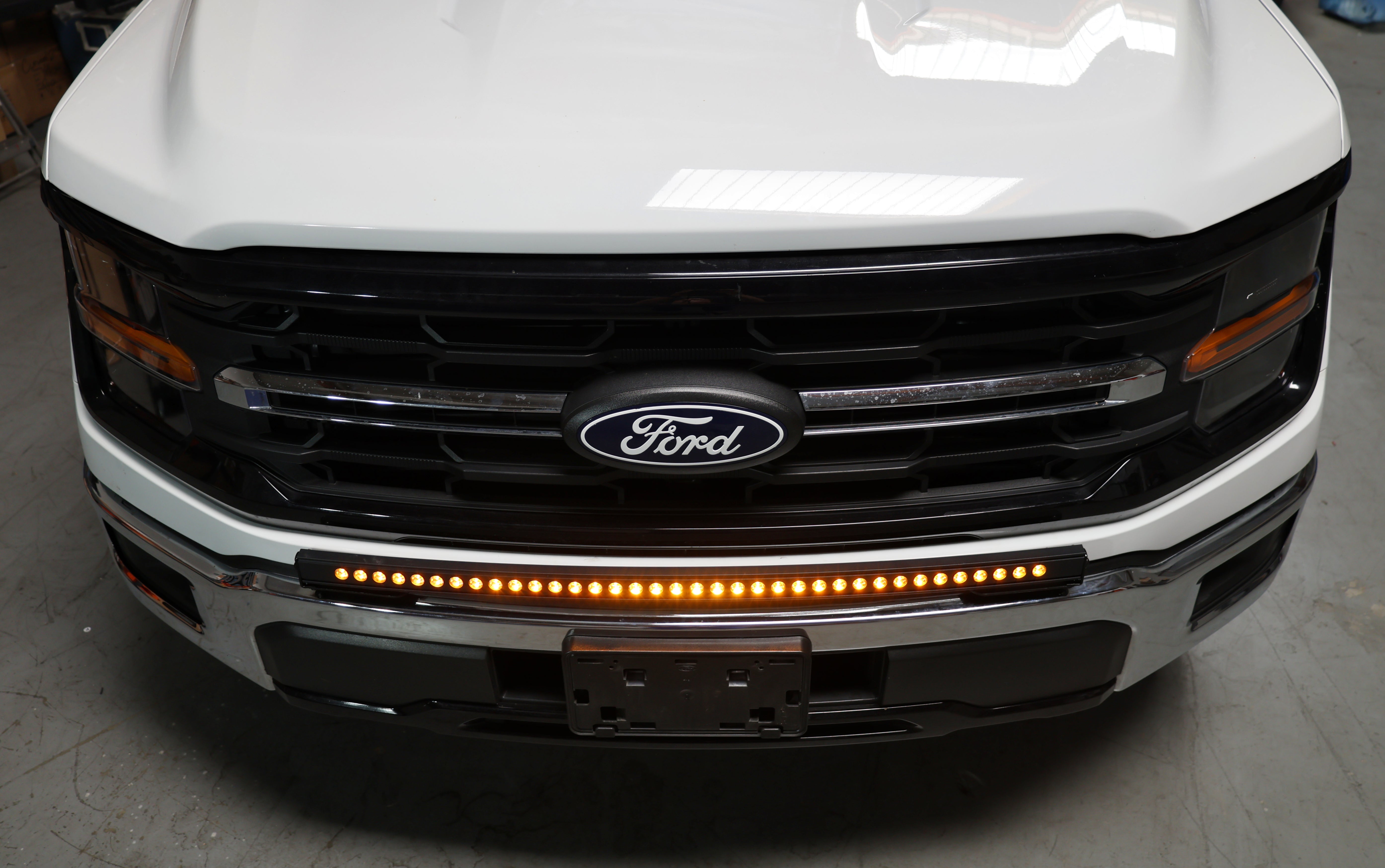 2024+ Ford F150 LightBar installed on the front grille for enhanced visibility and style.