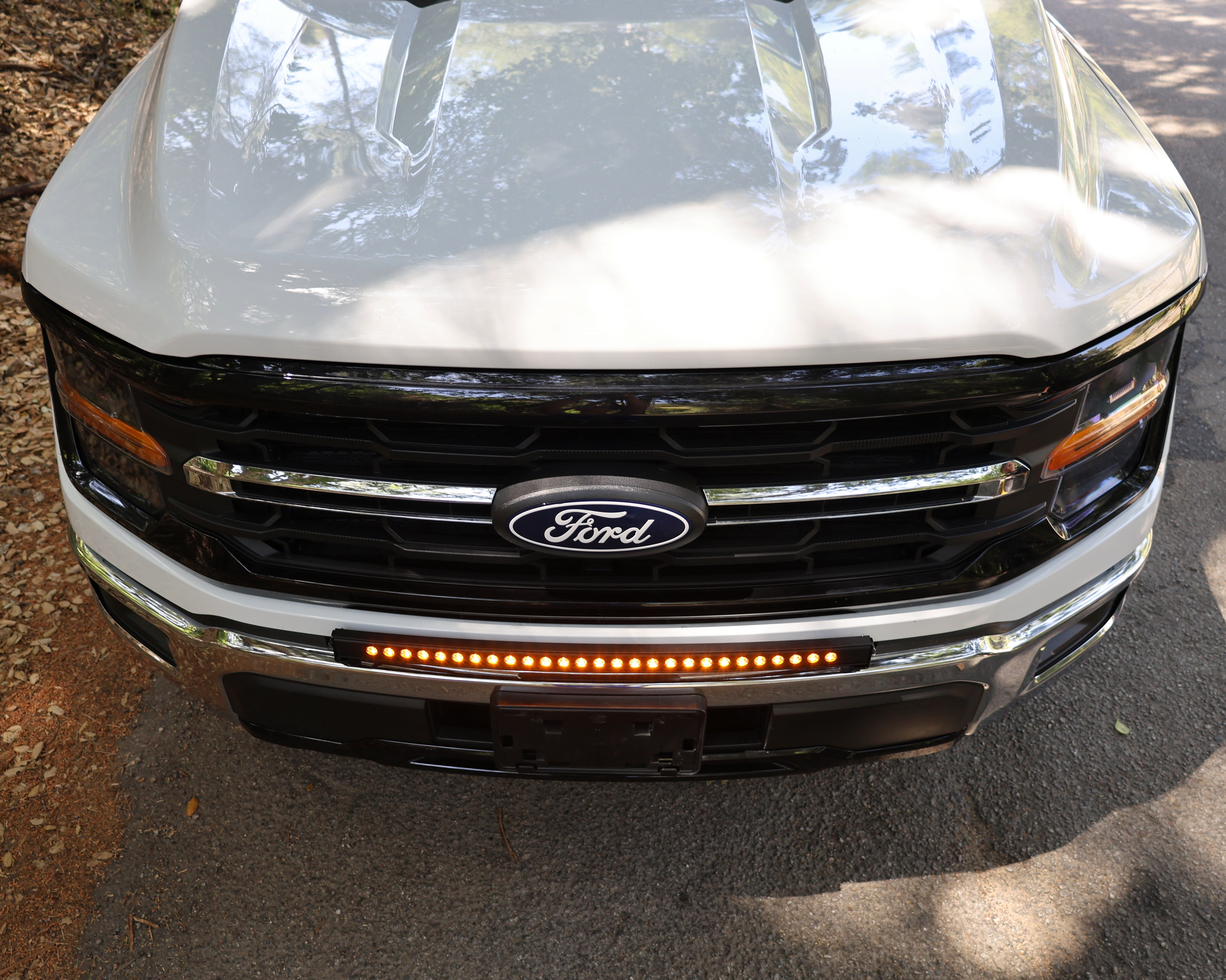 2024+ Ford F150 LightBar installed on the front grille of a Ford F150 truck, showcasing its sleek design.