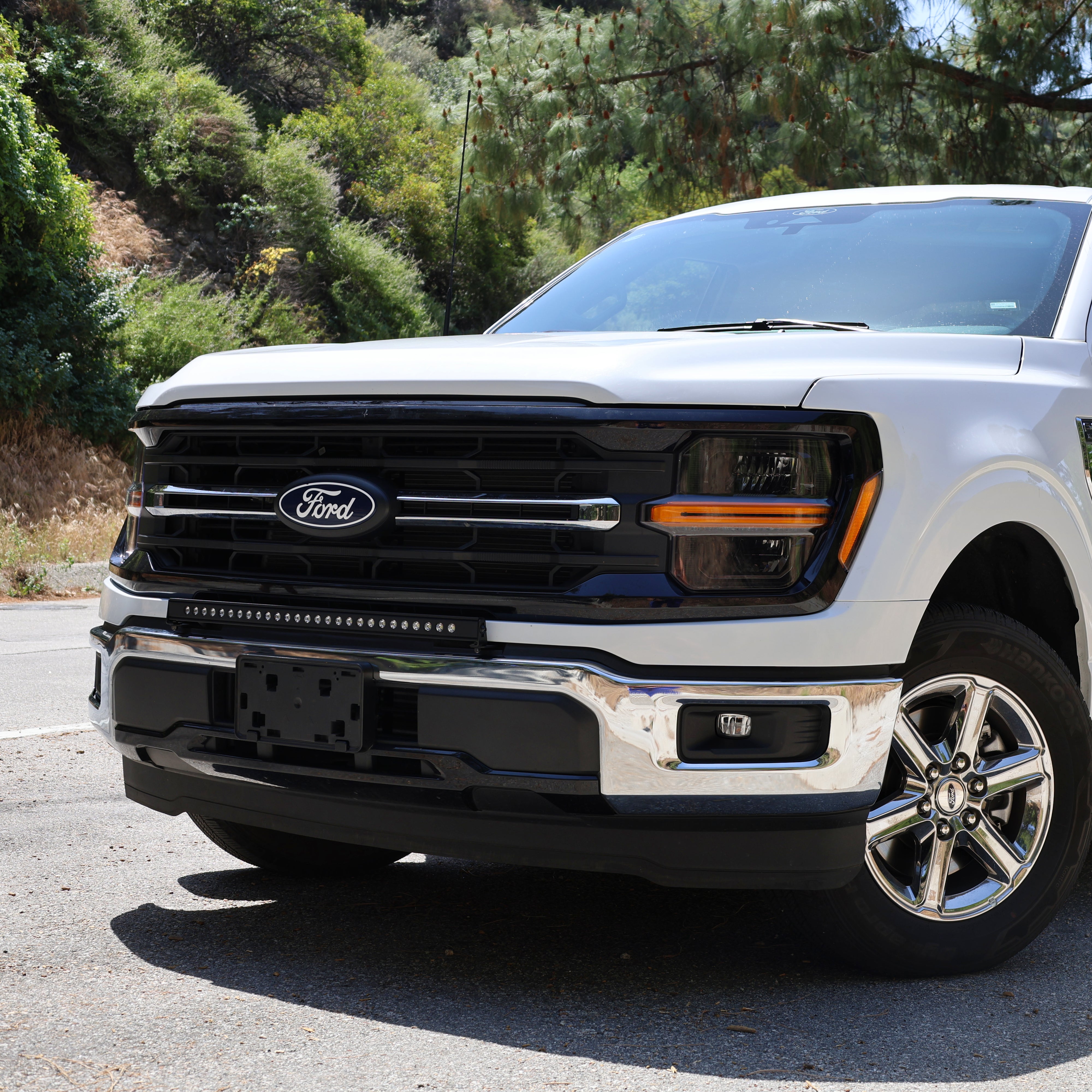 2024+ Ford F150 LightBar installed on a silver Ford F150, enhancing front visibility for off-road use.