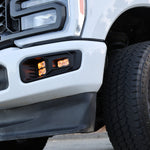 Ford Super Duty Fog Lights installed on 2023 Ford Super Duty F250 with rugged black wheels and front grille.