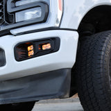 Ford Super Duty Fog Lights installed on 2023 Ford Super Duty F250 with rugged black wheels and front grille.
