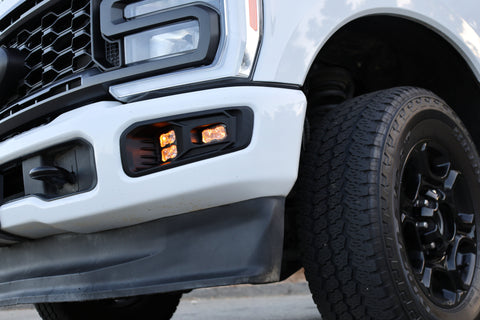 Ford Super Duty Fog Lights installed on 2023 Ford Super Duty F250 with rugged black wheels and front grille.