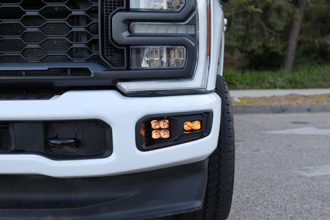 Ford Super Duty Fog Lights installed on a 2023 Ford F250 front bumper with illuminated fog lights.