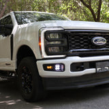 2023 Ford Super Duty Fog Lights installed on a white Ford F250, showcasing enhanced visibility and modern design.