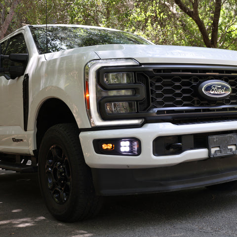 2023 Ford Super Duty Fog Lights installed on a white Ford F250, showcasing enhanced visibility and modern design.