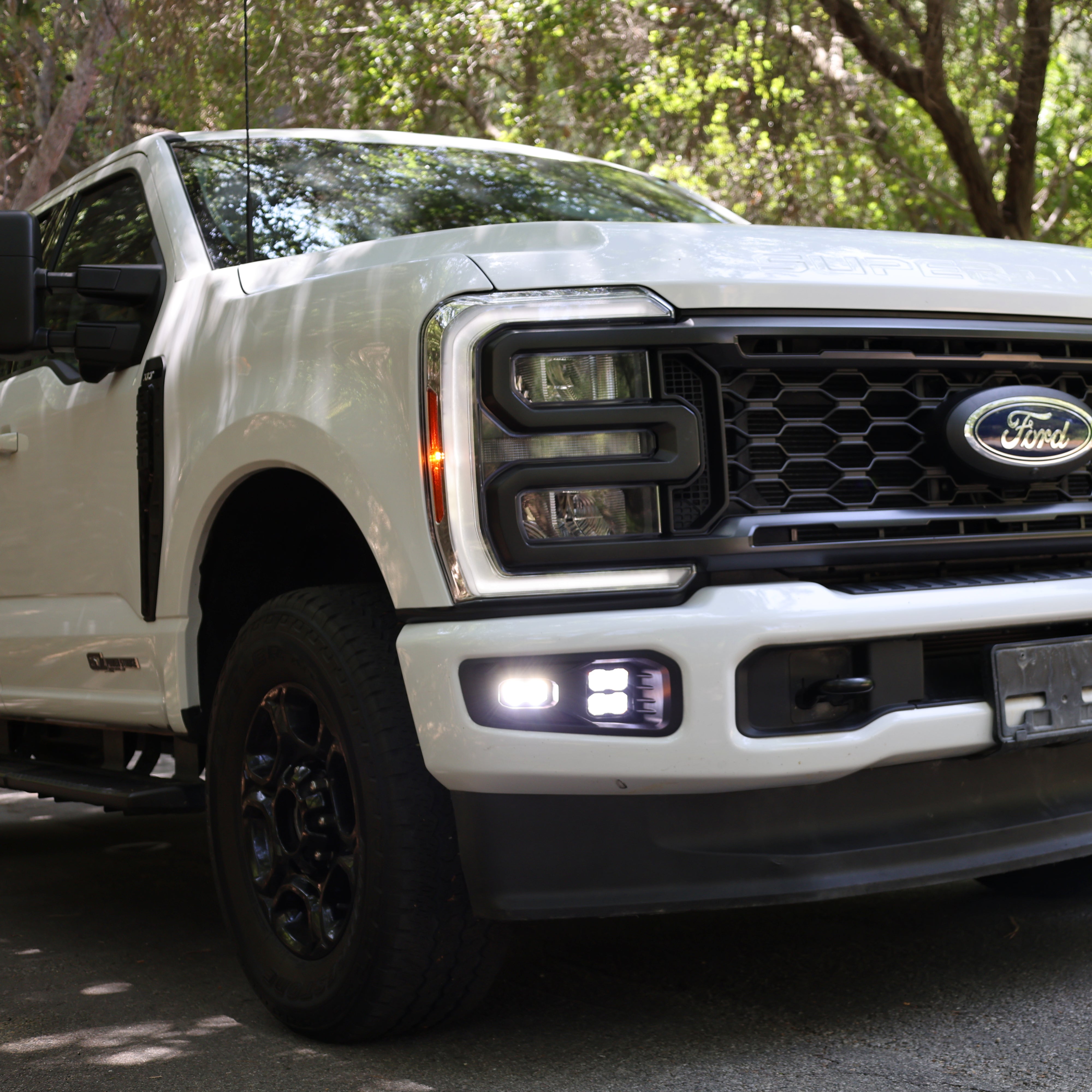 2023 Ford Super Duty Fog Lights installed on white F250 truck showcasing stylish design and enhanced visibility.