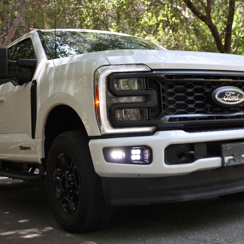 2023 Ford Super Duty Fog Lights installed on white F250 truck showcasing stylish design and enhanced visibility.