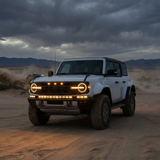 Ford Bronco Raptor Light Bar Extension for 2021+ — Ford Bronco Raptor Light Bar on rugged desert drive with LED rings and front light bar