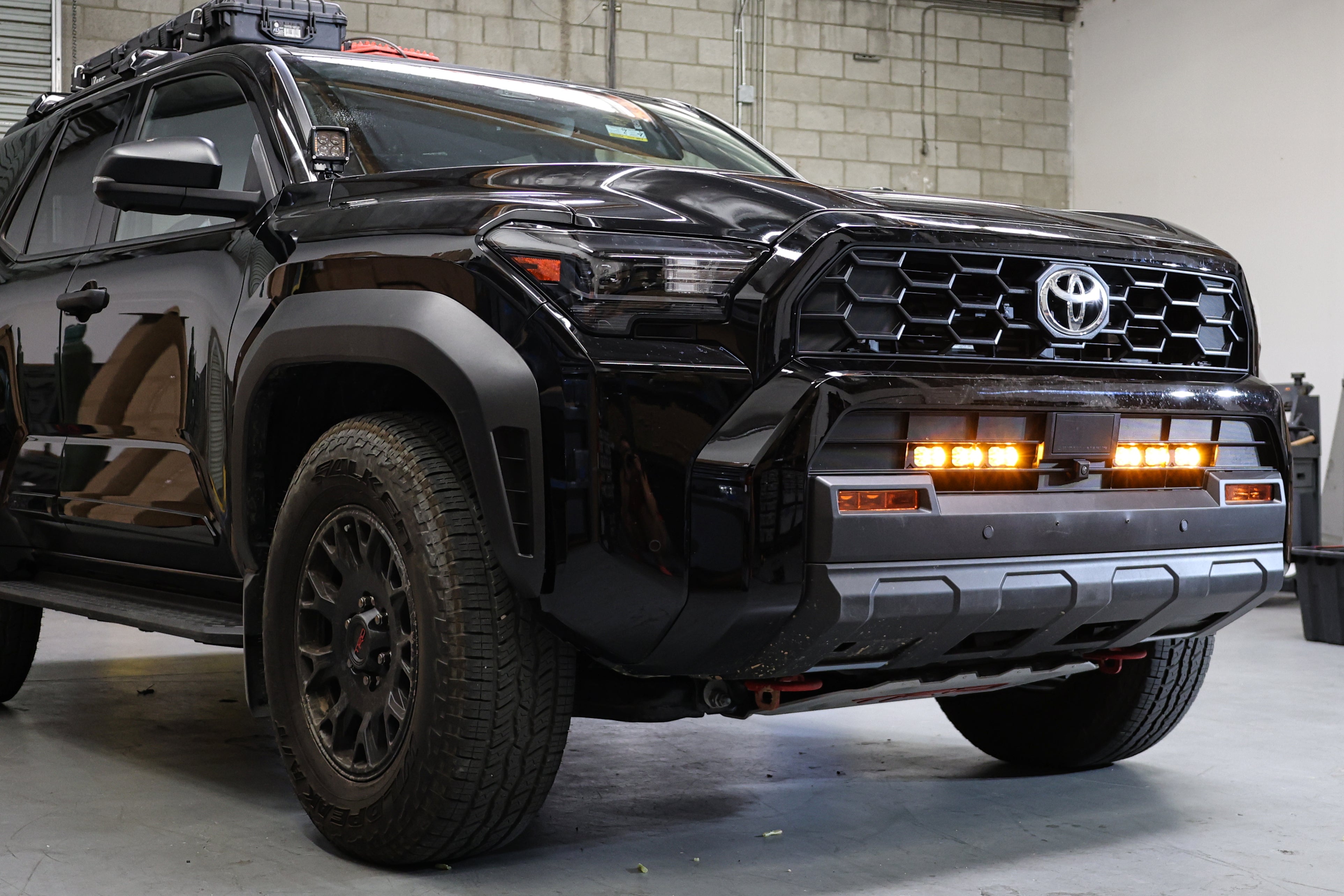 4Runner Light Bars installed on black 2025 Toyota 4Runner front bumper with amber LED light bars illuminated