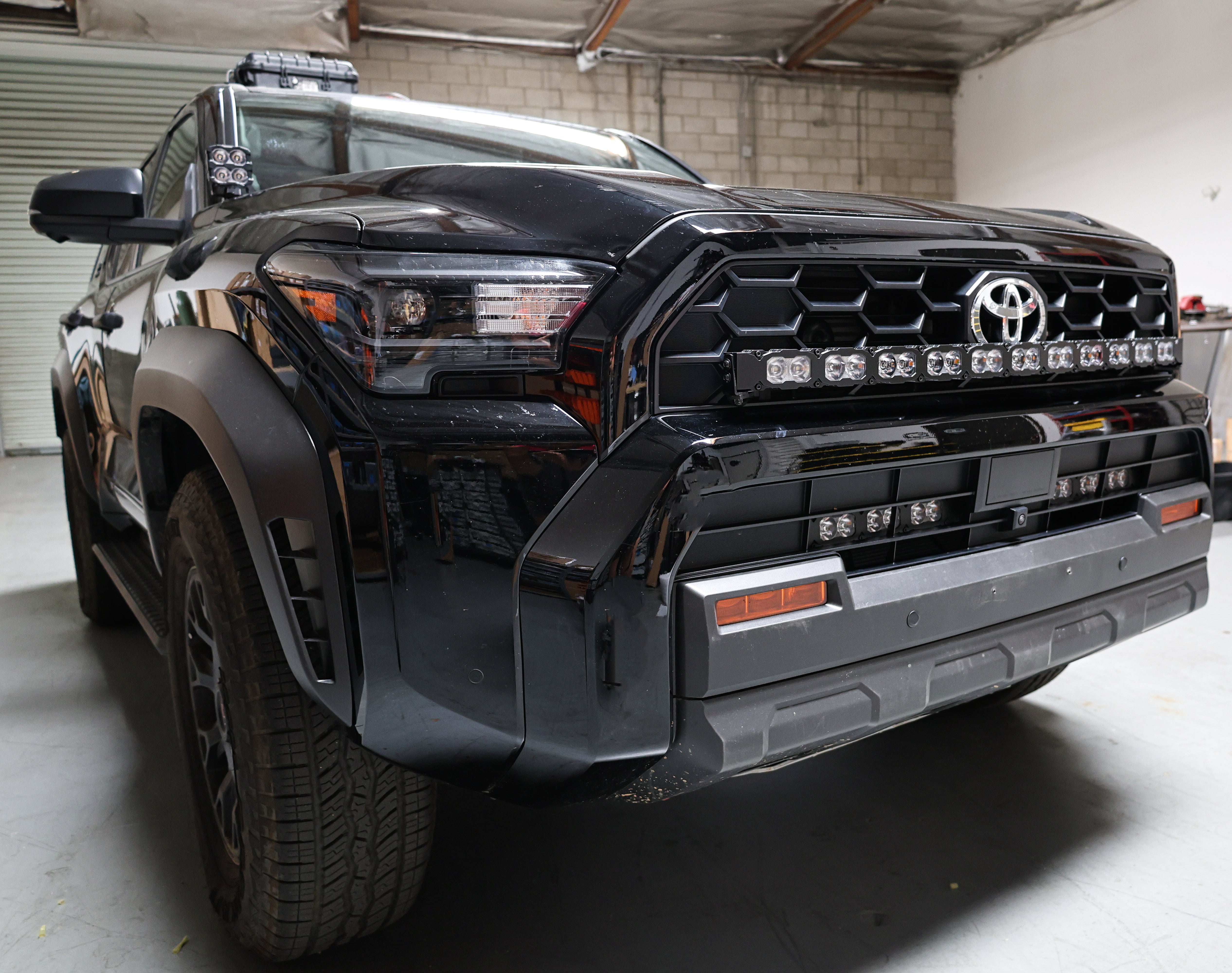 4Runner Light Bar PRO 40in curved LED grille mount on black 2025 Toyota 4Runner TRD Off-Road in garage
