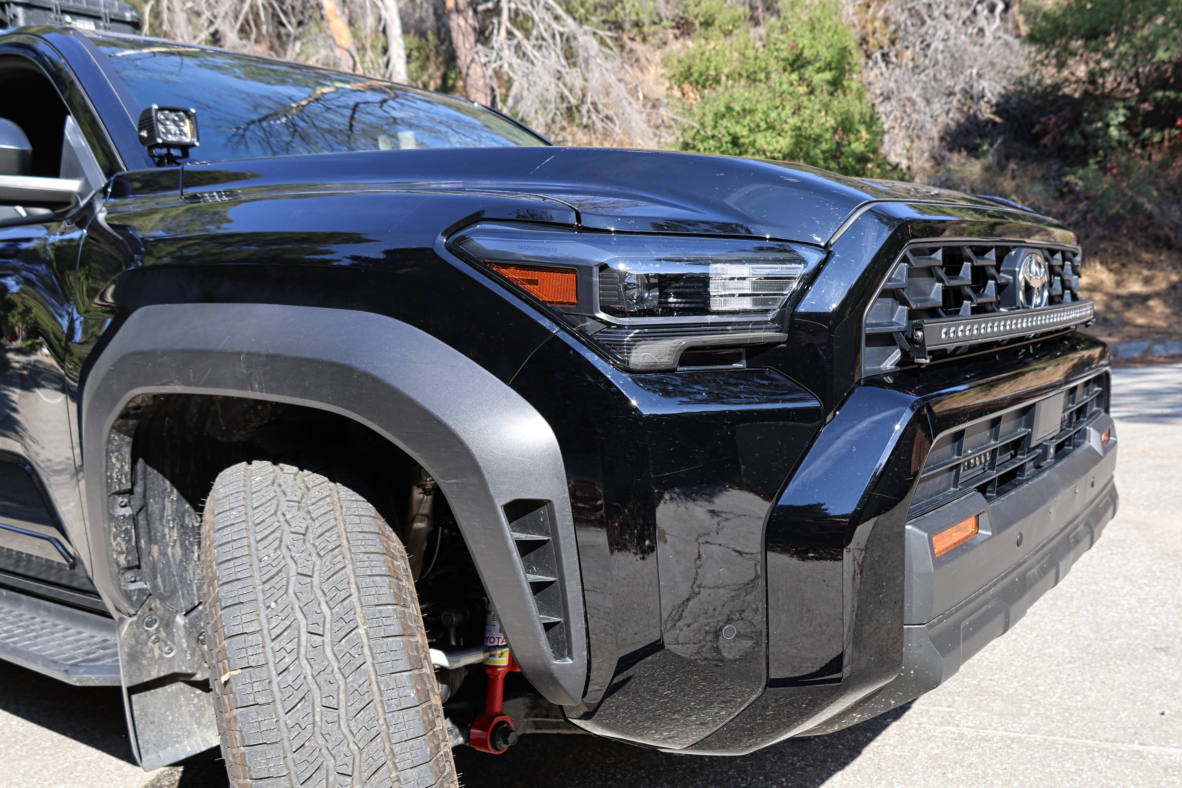 4Runner Ditch lights installed on 2025 Toyota 4Runner front bumper, close-up of dual color LED ditch light setup on driver side