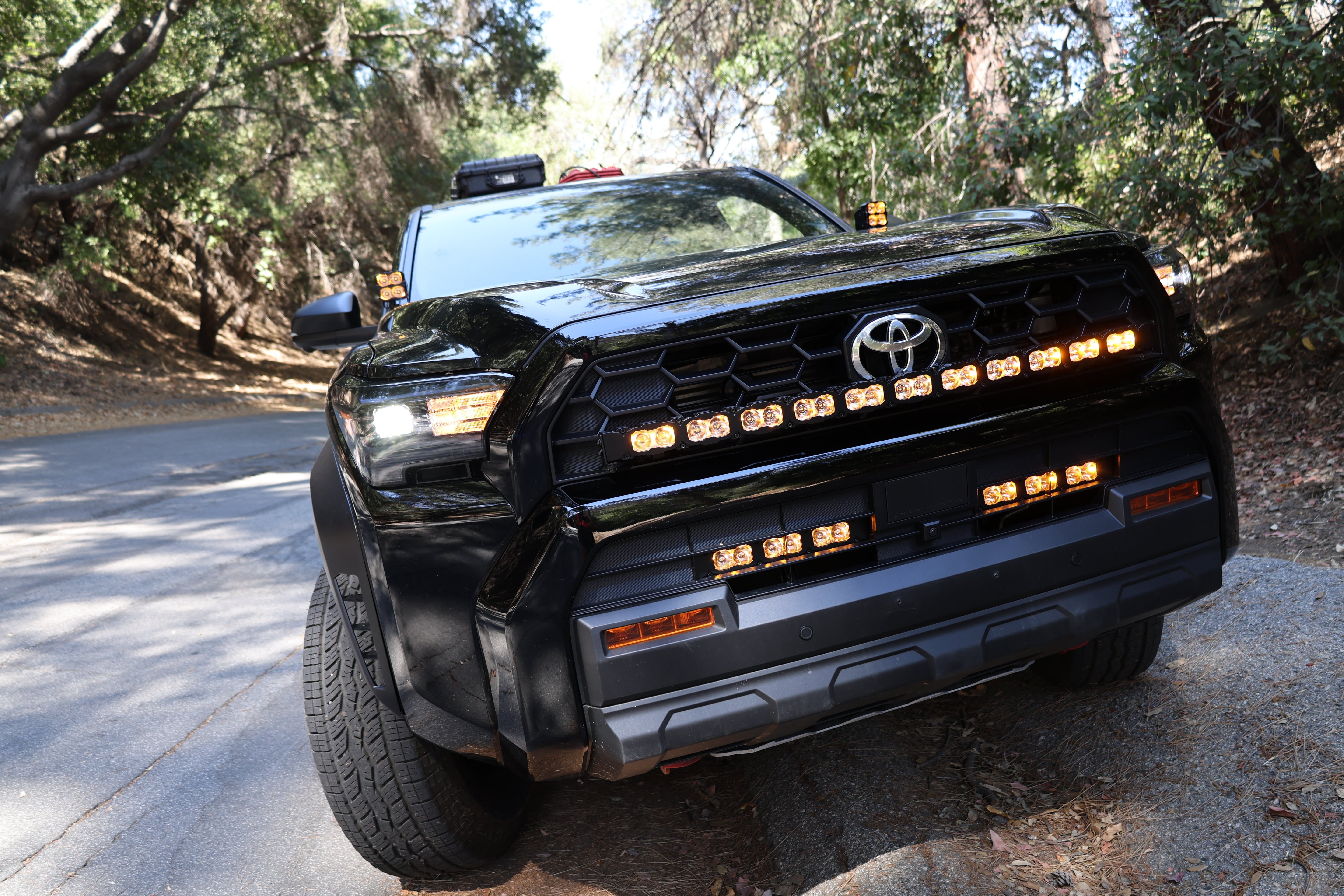 4Runner Light Bar PRO 40in curved LED front grille mount on 2025 Toyota 4Runner TRD model driving on forest road