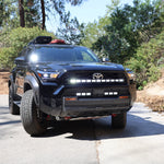 4Runner Light Bar installed on black 2025 Toyota 4Runner TRD grille front view on trail road