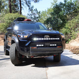 4Runner Light Bar installed on black 2025 Toyota 4Runner TRD grille front view on trail road