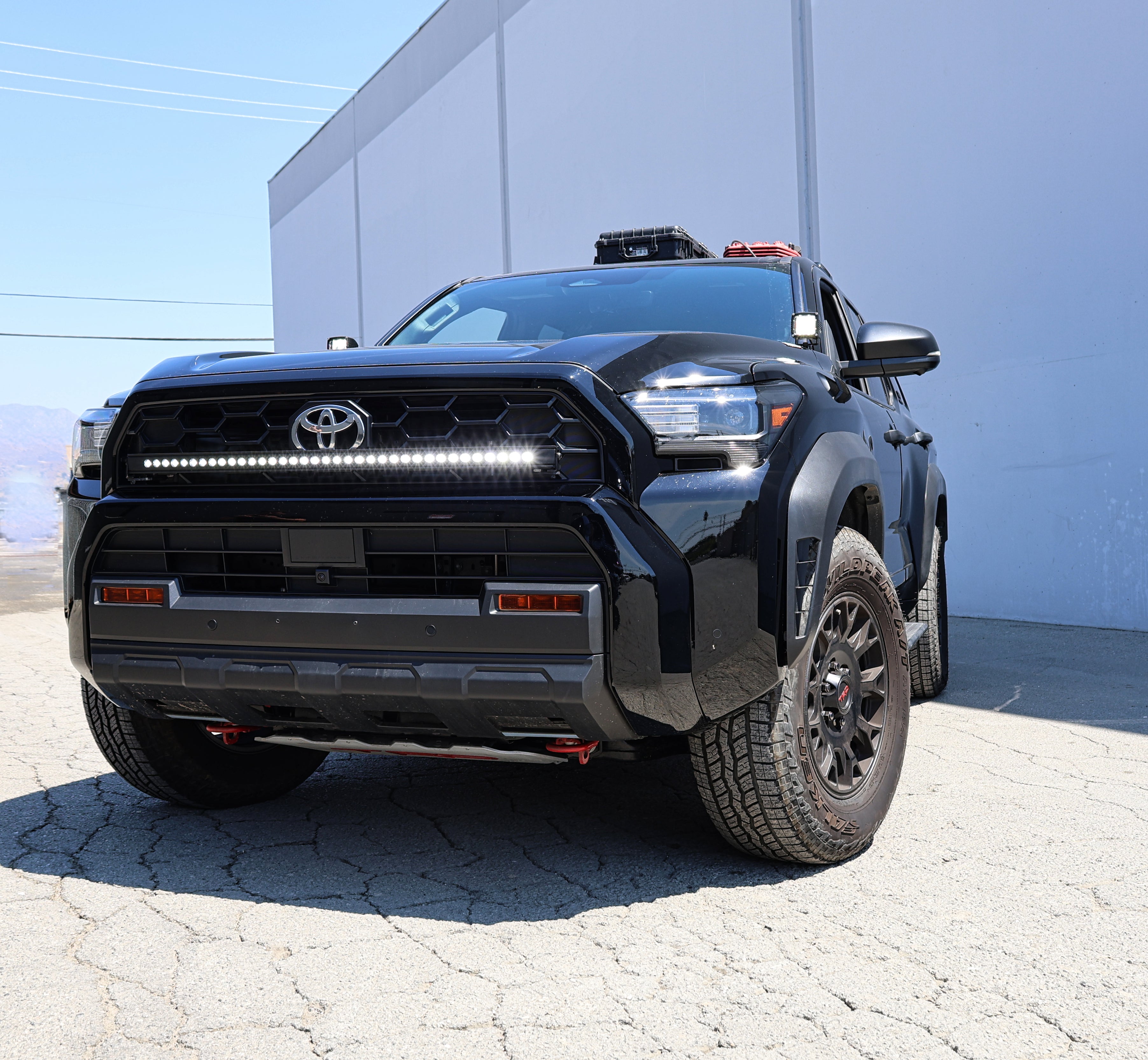 4Runner Light Bar slim 40in LED curved grille-mounted on black 2025 Toyota 4Runner TRD Off-Road front view