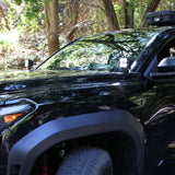 4Runner Ditch lights on 2025 Toyota 4Runner PRO with dual color amber DRL installed on black SUV in forest setting