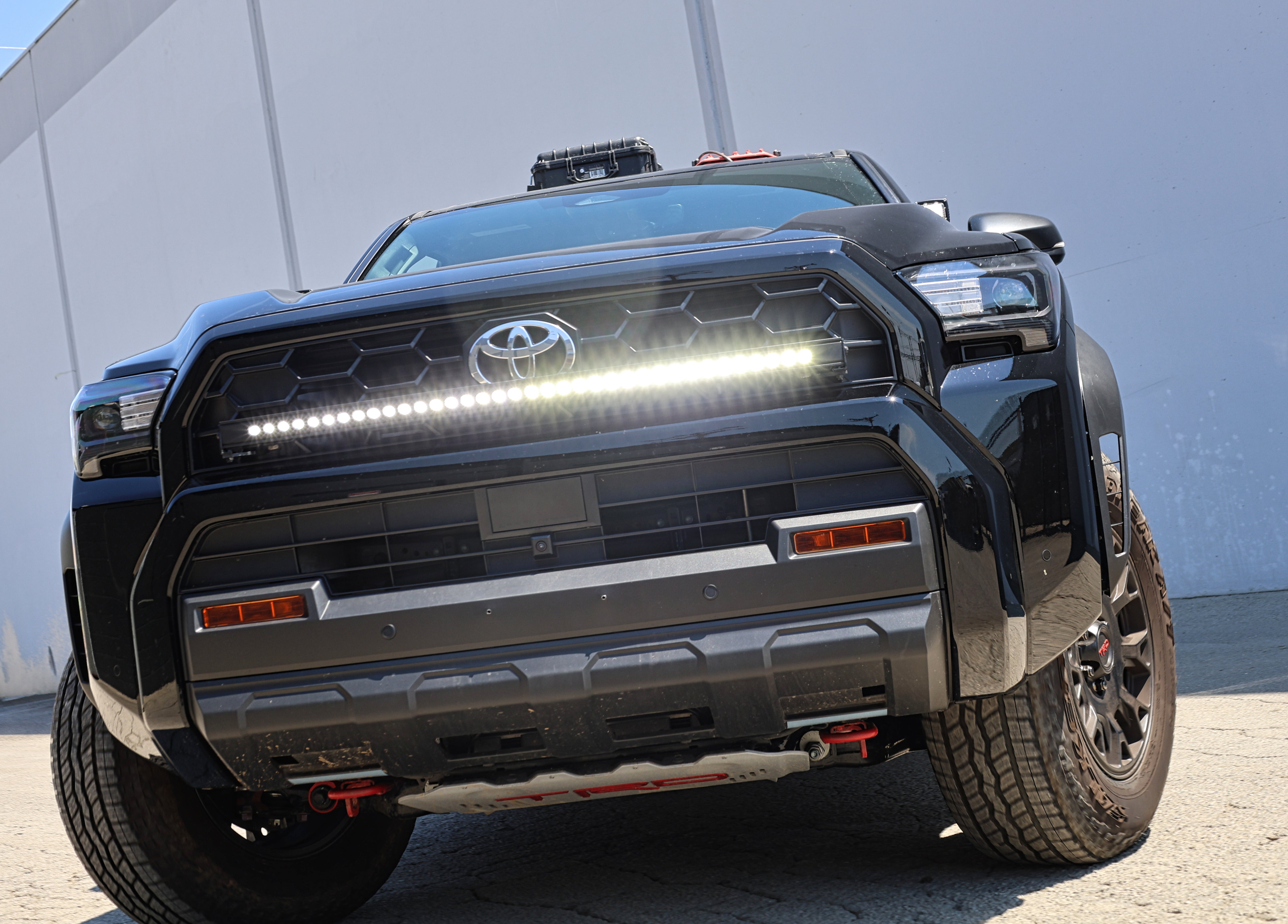 4Runner Ditch lights on 2025 Toyota 4Runner with dual color LED light bar and amber DRL backglow installed on front bumper