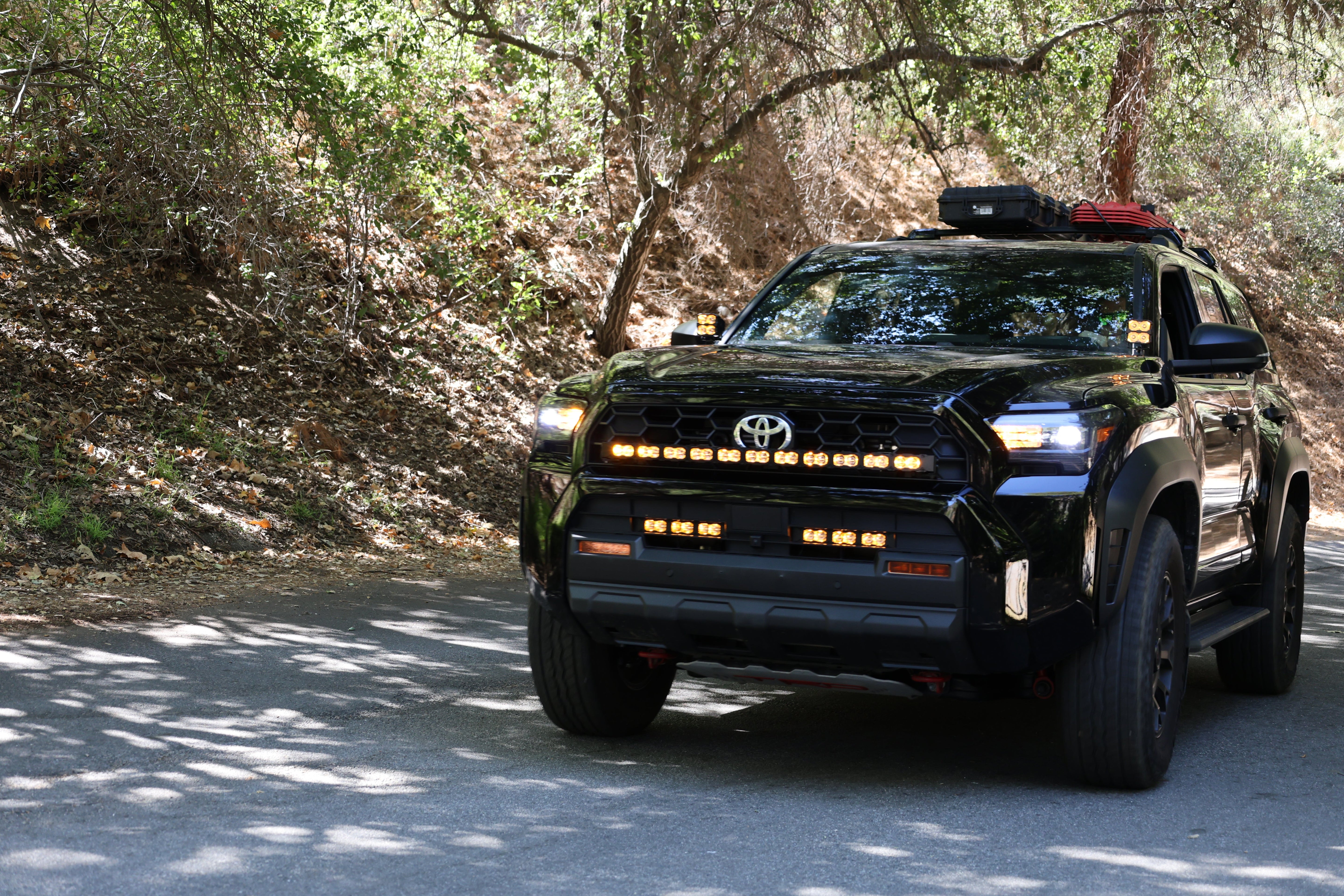4Runner Light Bar PRO 40in curved LED on 2025 Toyota 4Runner off-road SUV driving through forest road