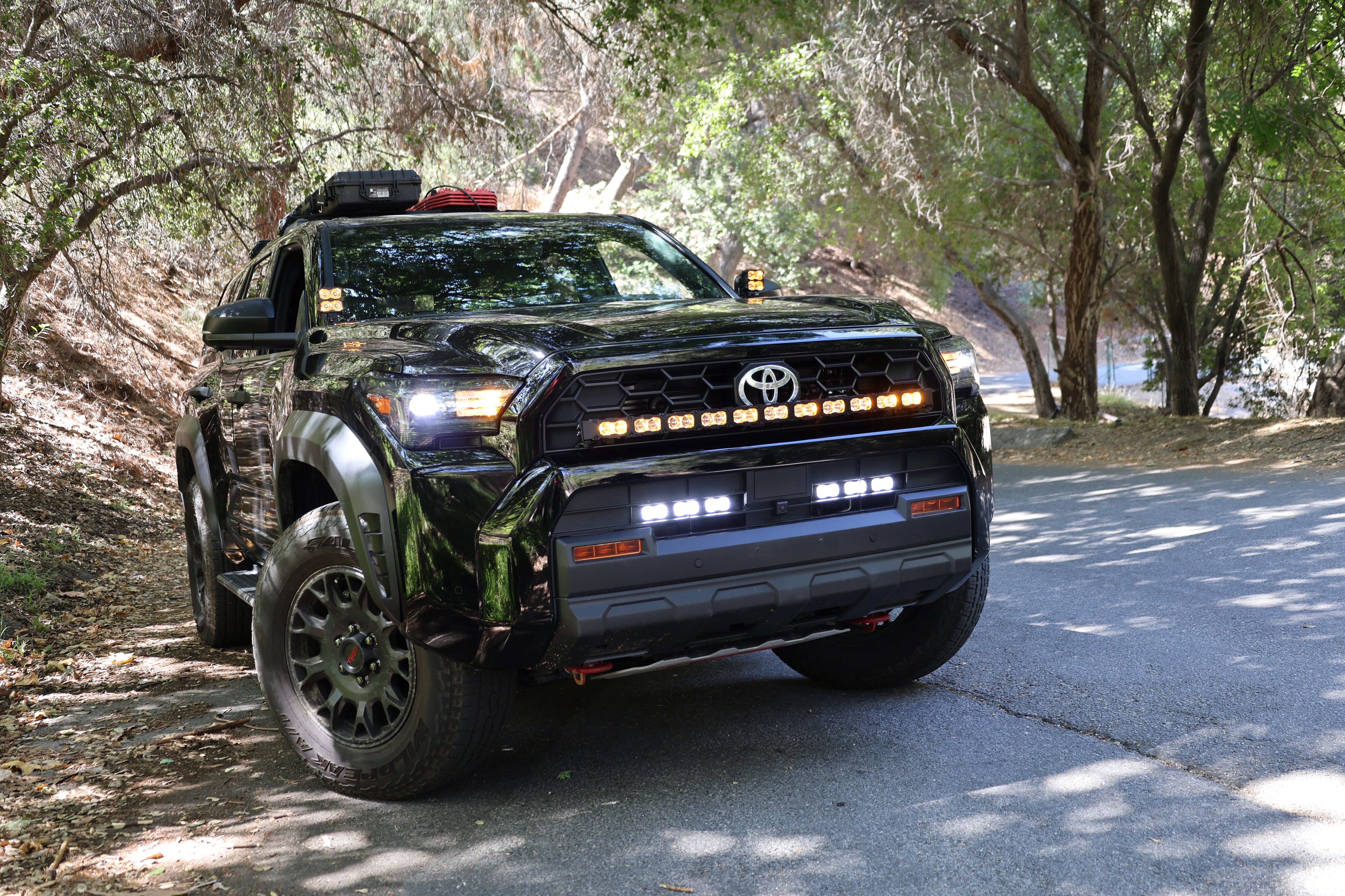 4Runner Light Bar PRO curved 40in LED installed in front grille on 2025 Toyota 4Runner TRD Off-Road parked on forest road