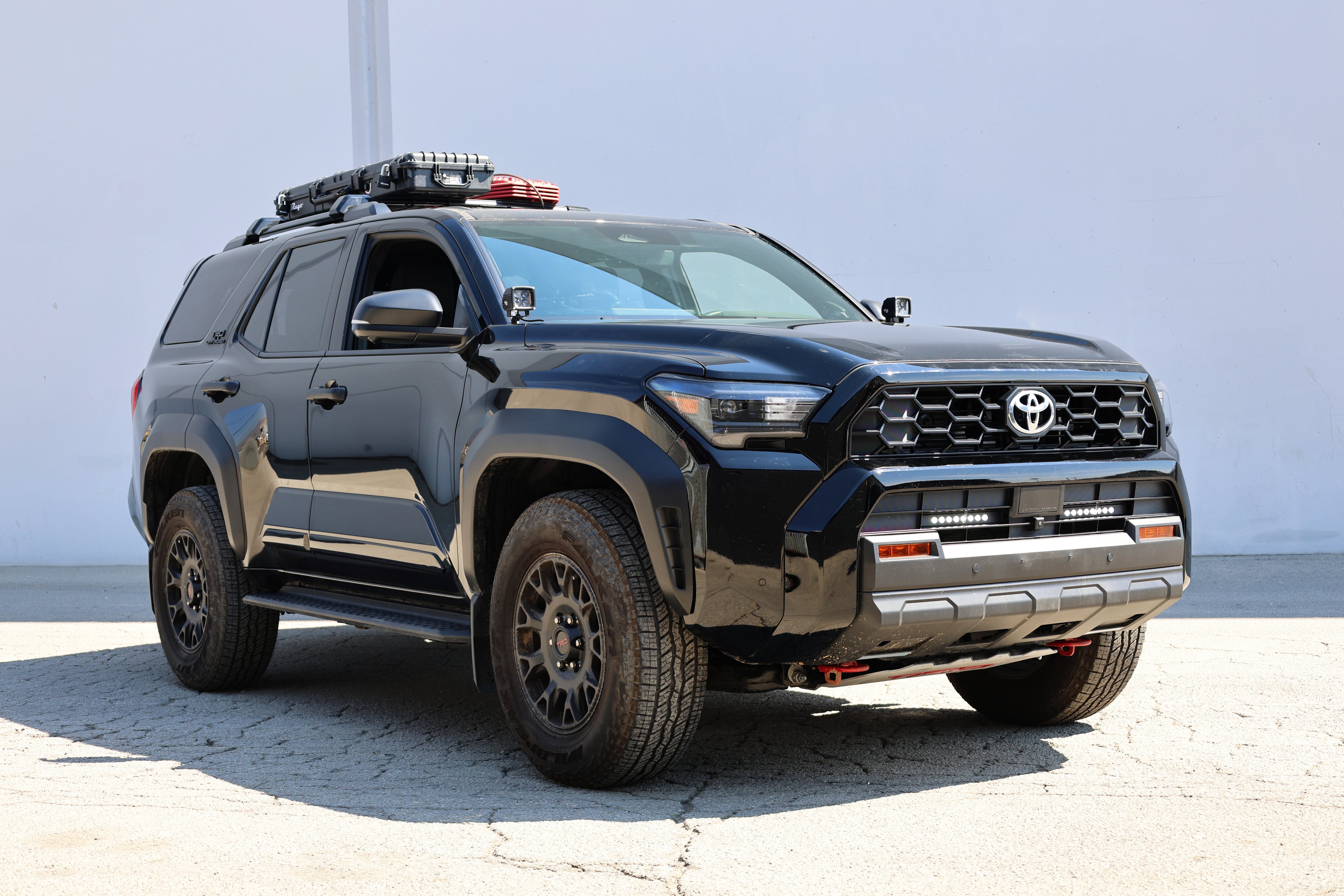 4Runner Light Bars installed on black 2025 Toyota 4Runner with slim 11in LED grille light bars shown from front side view