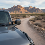 Bronco Raptor Ditch Lights on rugged Ford Bronco Raptor with dual color amber DRL backglow in desert terrain