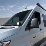 2019+ Mercedes Sprinter ditch light LED pod lit white at the base of the side mirror, close-up