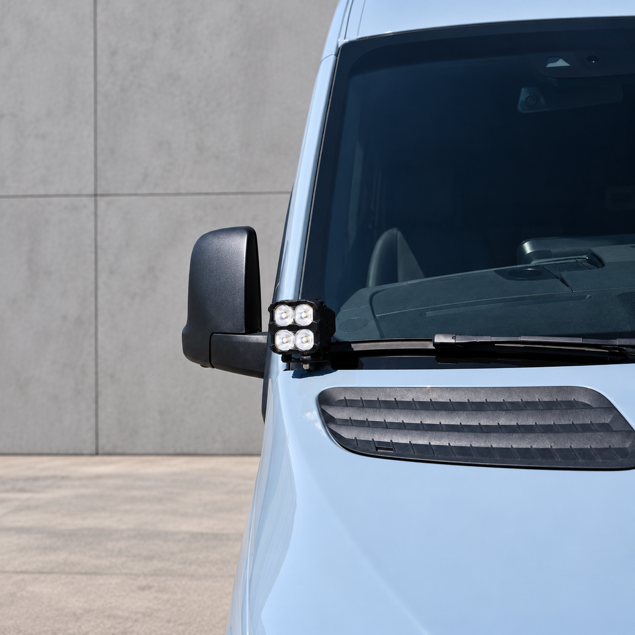 2019+ Mercedes Sprinter Ditch Lights PRO 40W LED pod lit white at the base of the driver side mirror