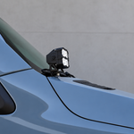 Side close-up of a 2019+ Mercedes Sprinter Ditch Lights PRO pod and metal bracket bolted at the mirror base, no drilling