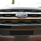front view of black ford expedition with behind grille led light bar for off roading